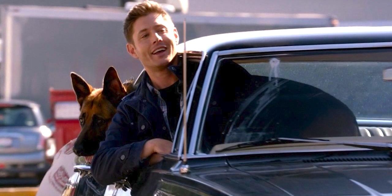 Dean and his dog hang their heads out of their car window on Supernatural