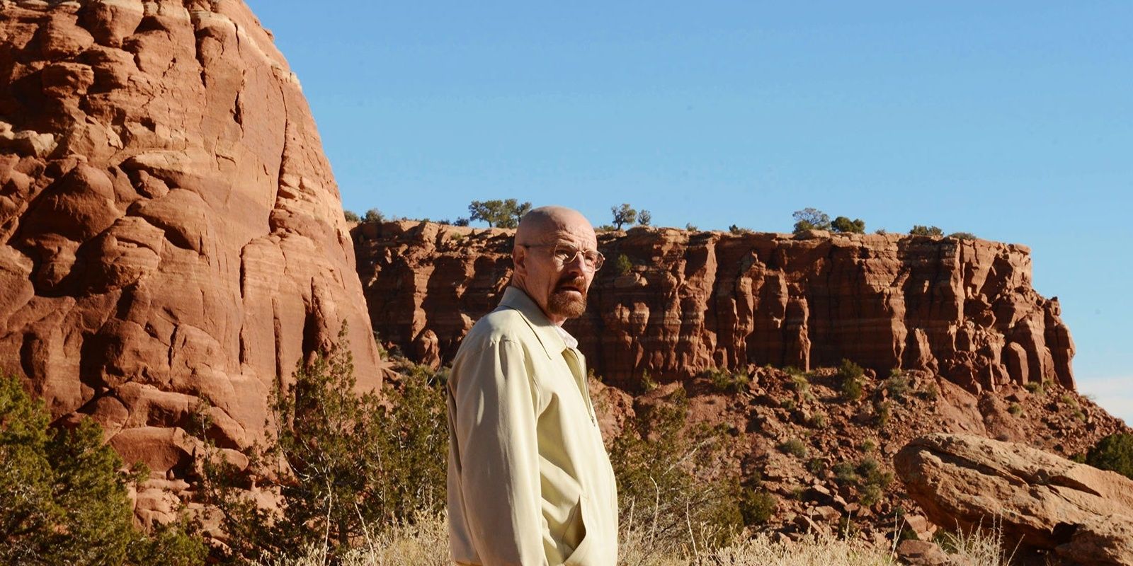 Walter White stands alone in the desert in Breaking Bad.