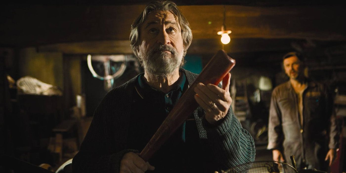 Fred Blake holding a bat in The Family.
