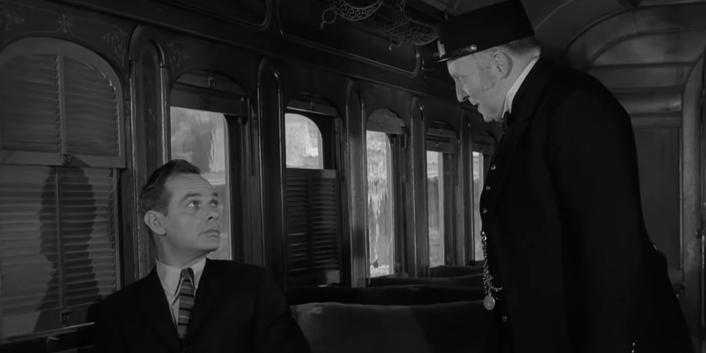 Gart speaking with the strange conductor in A Stop At Willoughby of The Twilight Zone