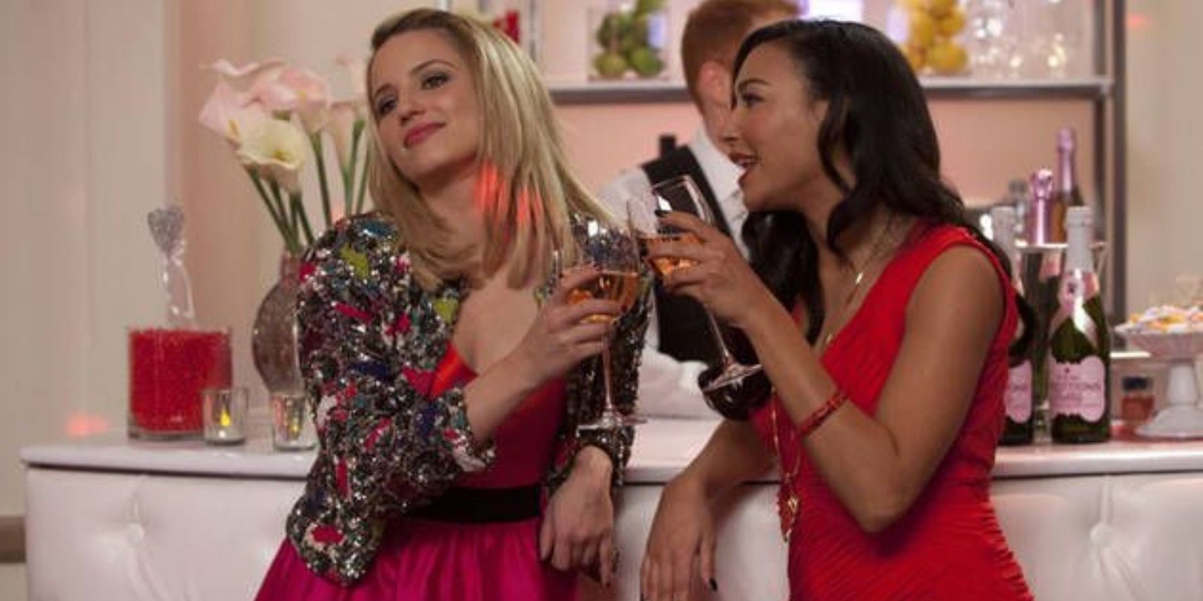 Quinn and Santana toasting at a party in Glee.