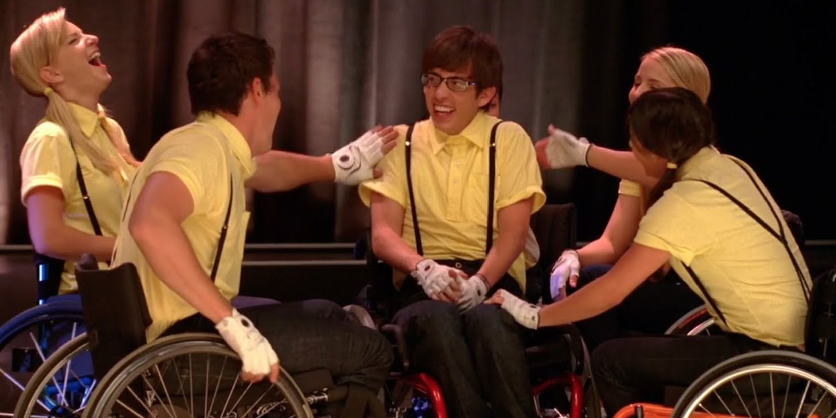 Club members surround Artie after performing &quot;Proud Mary&quot; in wheelchairs in Wheels S1E09