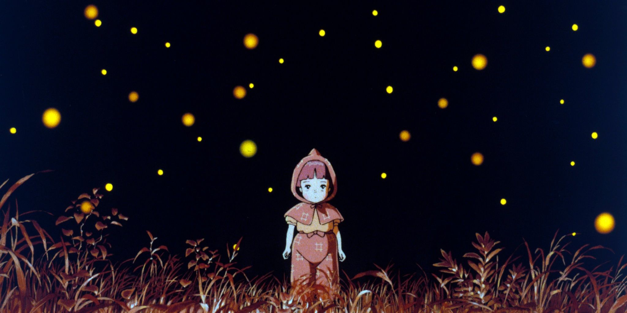 Setsuko standing among the fireflies in Grave of the Fireflies