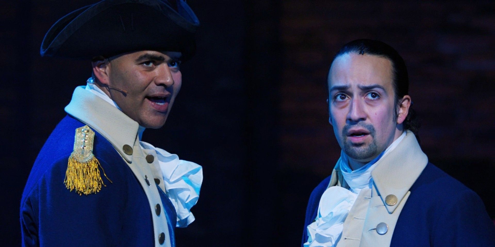 George Washington and Alexander Hamilton look out on the audience in Hamilton