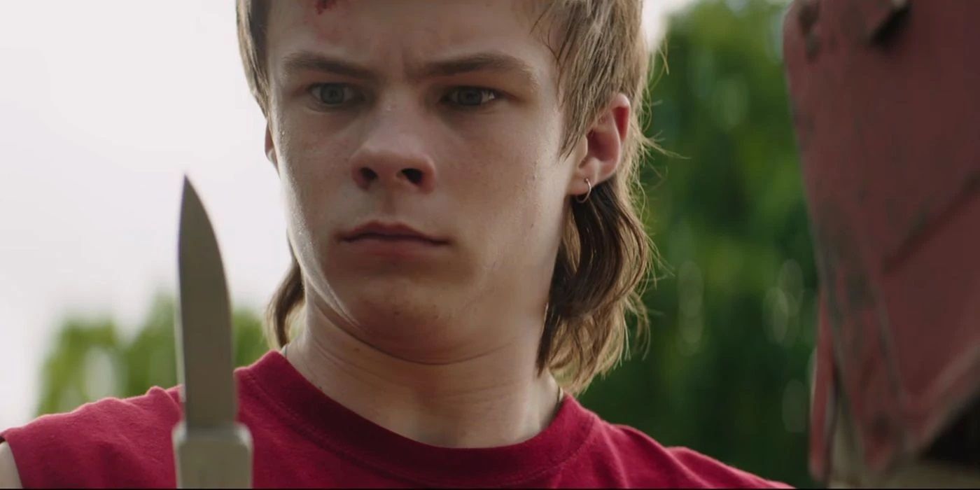 Nicholas Hamilton as Henry Bowers wielding a knife in IT: Chapter One (2017)