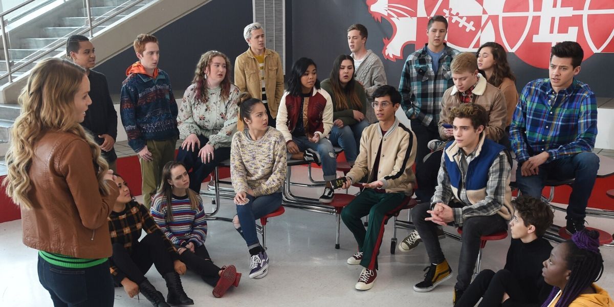 High School Musical: The Musical: The Series sit in a circle.