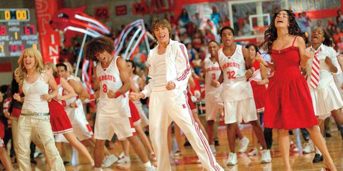 The cast of High School Musical perform in the gym in the first movie's finale number