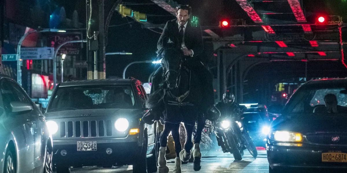 John Wick riding a horse being chased by motorcycles