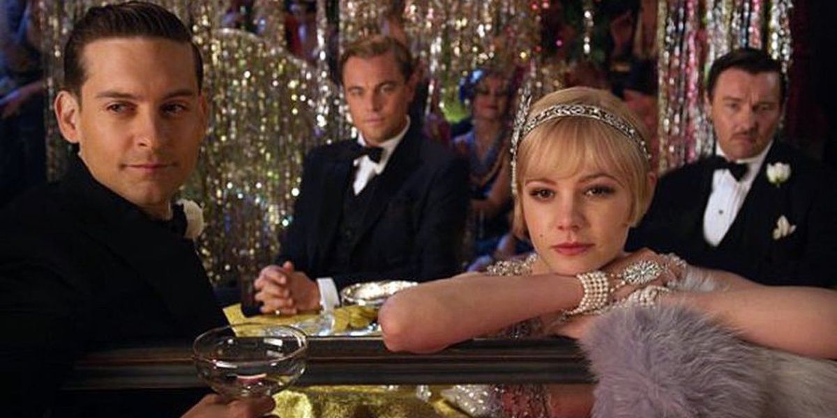 Tom, Gatsby, Nick, and Daisy at a party in The Great Gatsby