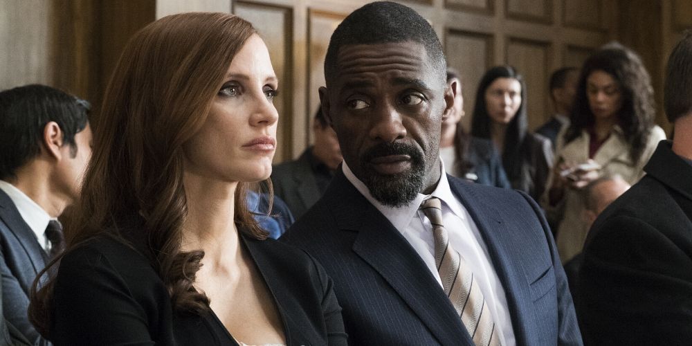 Molly and Charlie at a court house in Molly's Game