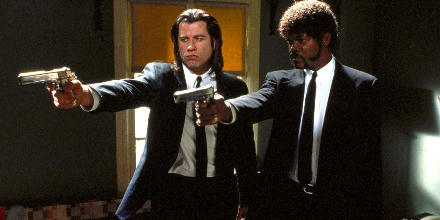 Jules and Vincent with their guns pointed in Pulp Fiction
