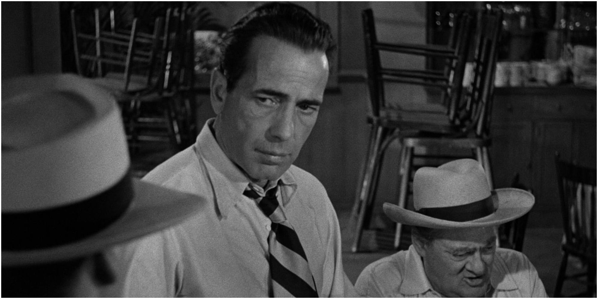 Humphrey Bogart in Key Largo looking at someone off camera.