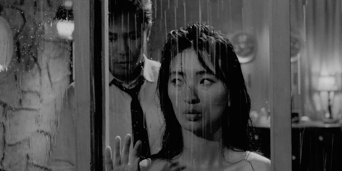 Kim Jin-kyu and Lee Eun-shim by the window in The Housemaid (1960)