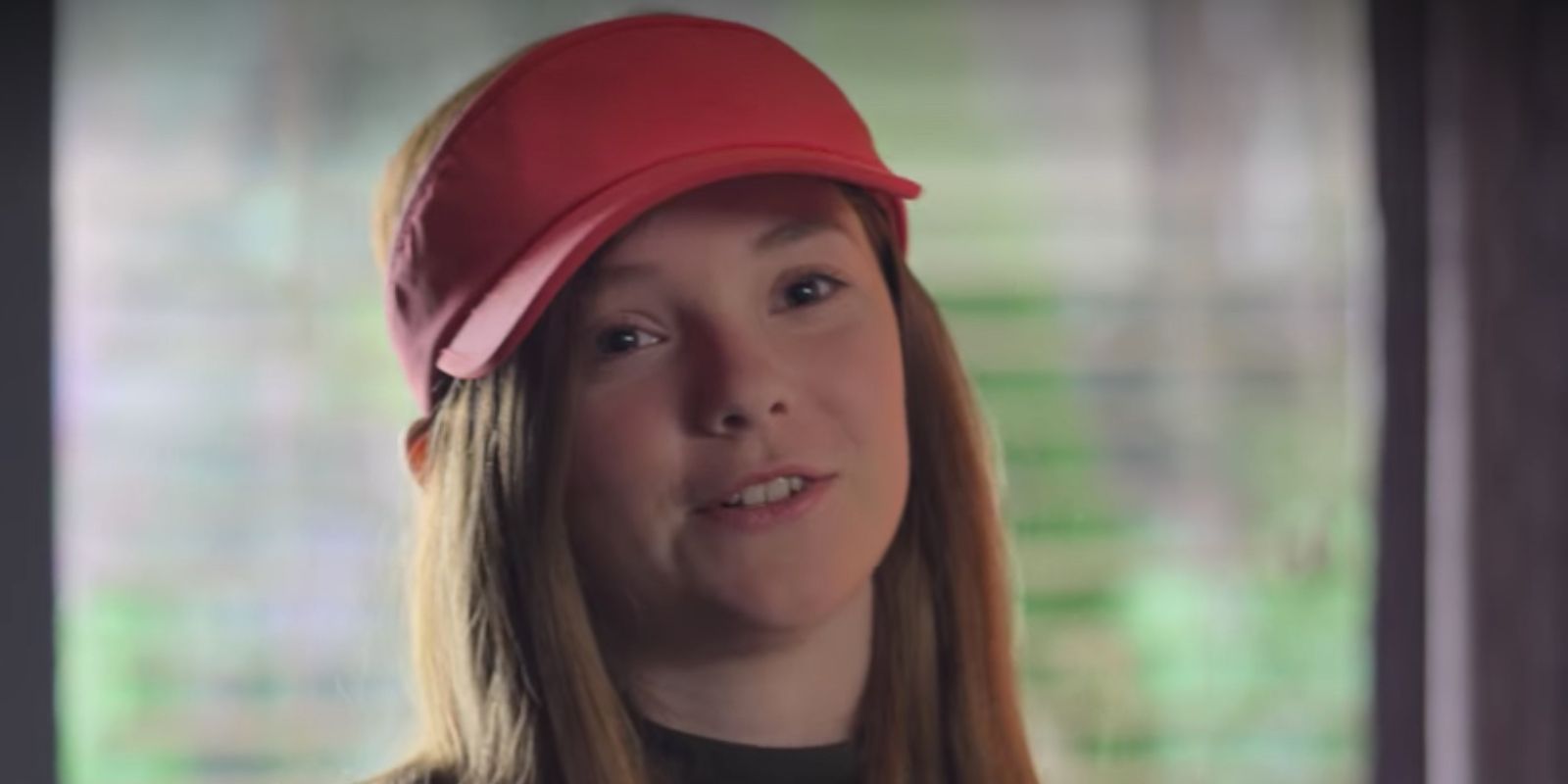 Kristy wearing a red baseball cap in The Baby-Sitters Club