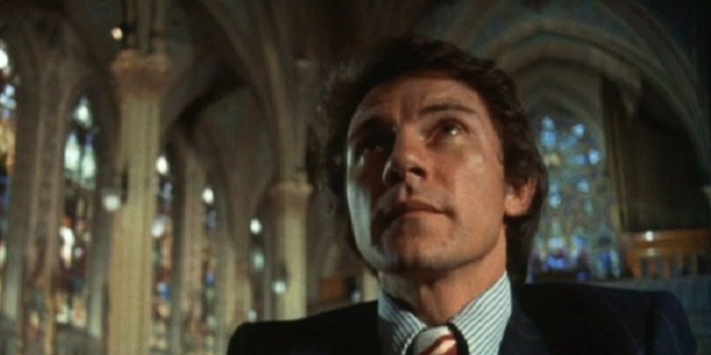 Harvey Kietel sits in a church from Mean Streets