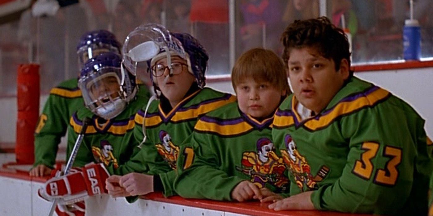 Several players look on from the bench in The Mighty Ducks 