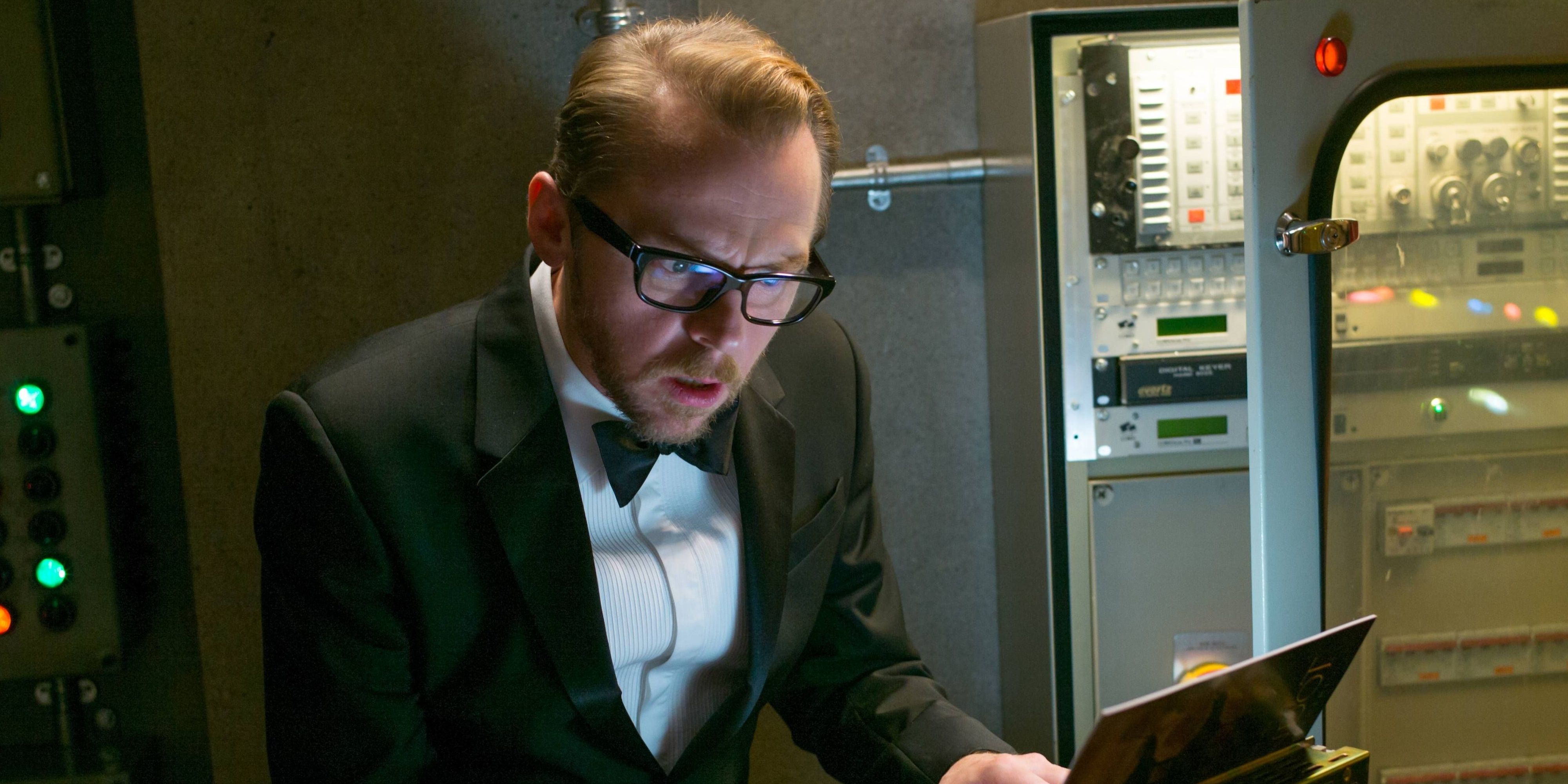 Benji works on a laptop dressed in a tuxedo in Mission: Impossible - Rogue Nation