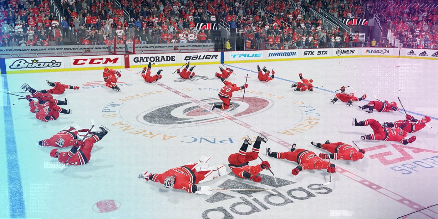 A group of players lay down on the ice in NHL 20.