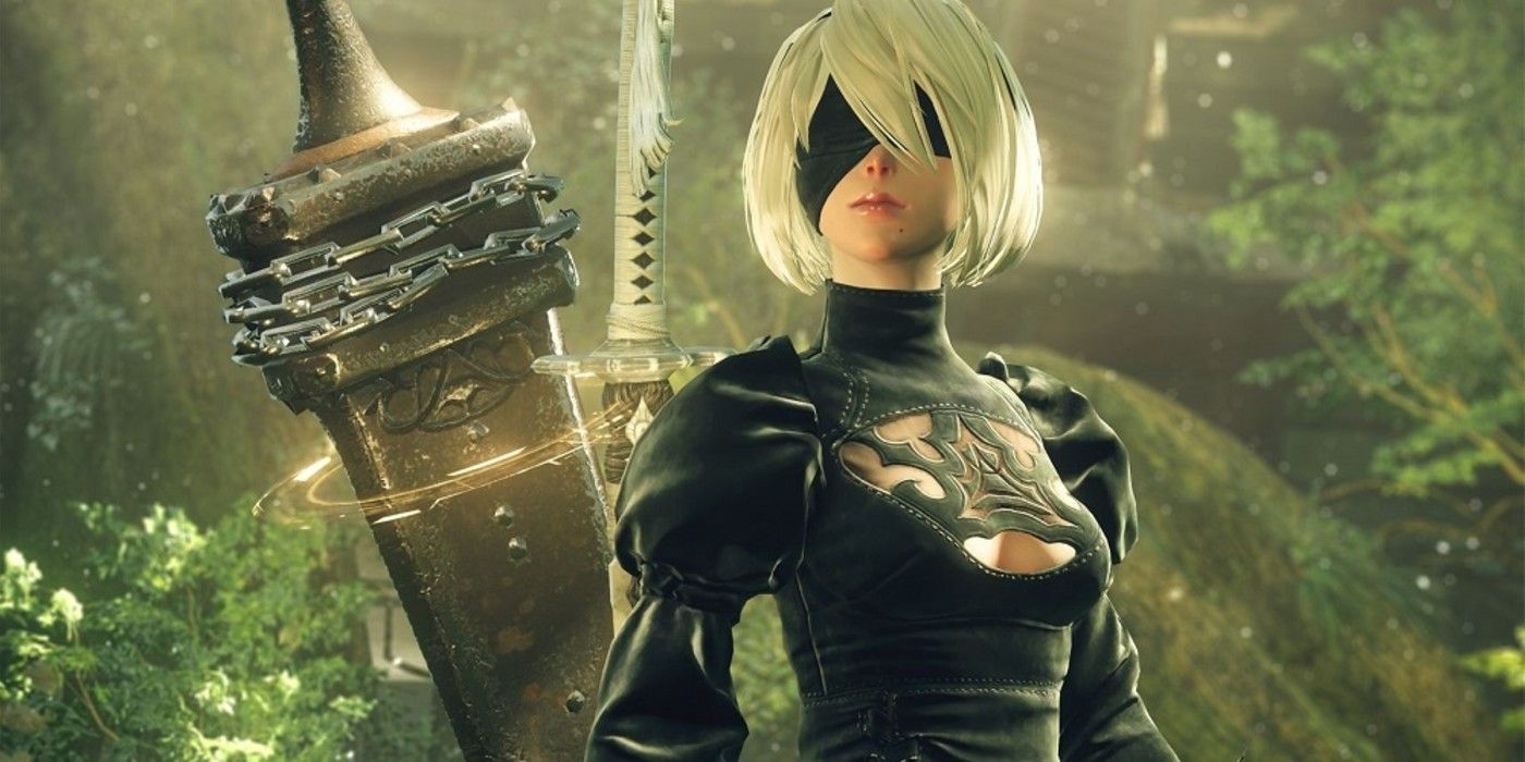 2B is standing in a forest in NieR Automata.