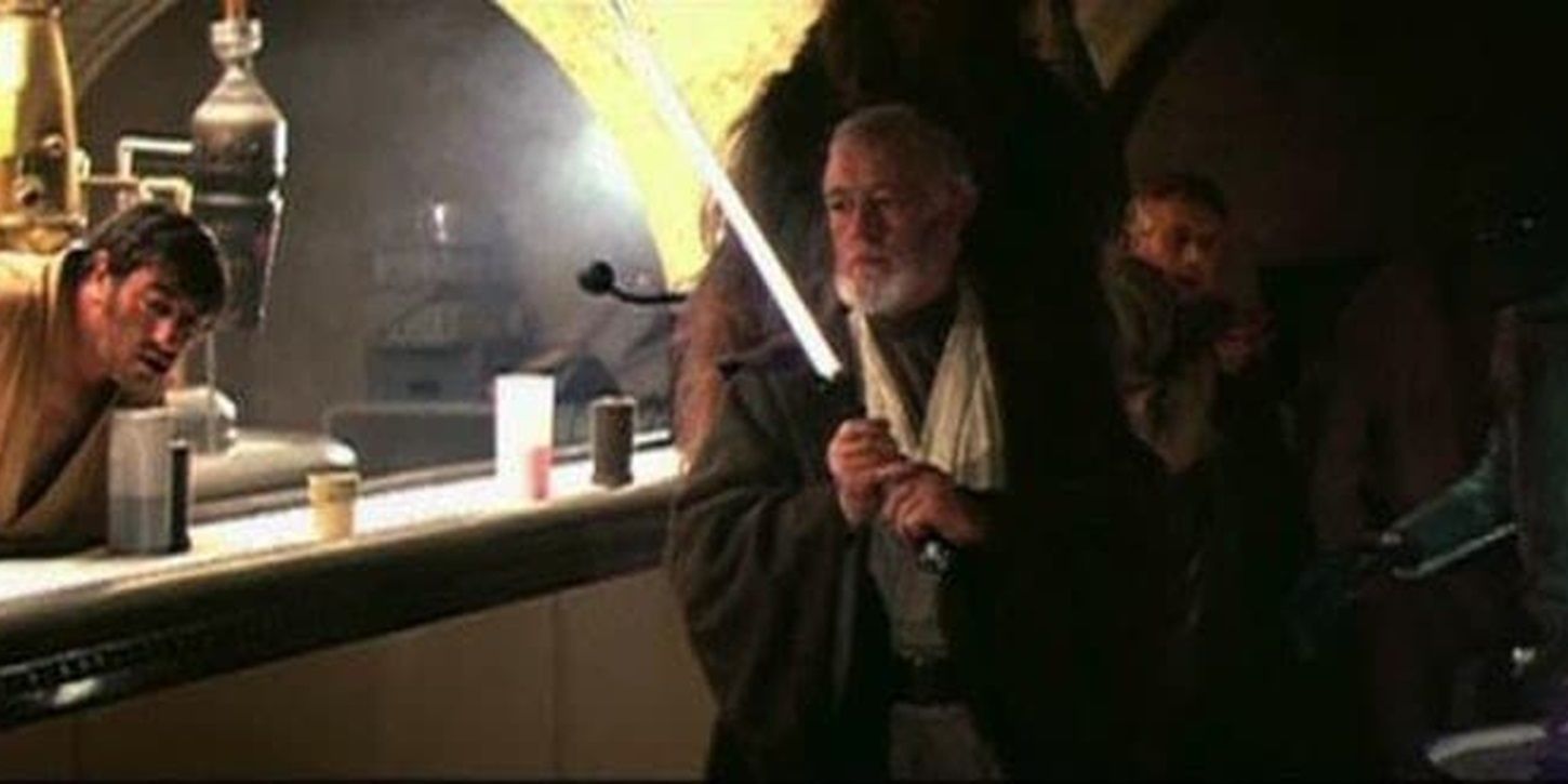 Obi-Wan uses his lightsaber in the Mos Eisley cantina in Star Wars.