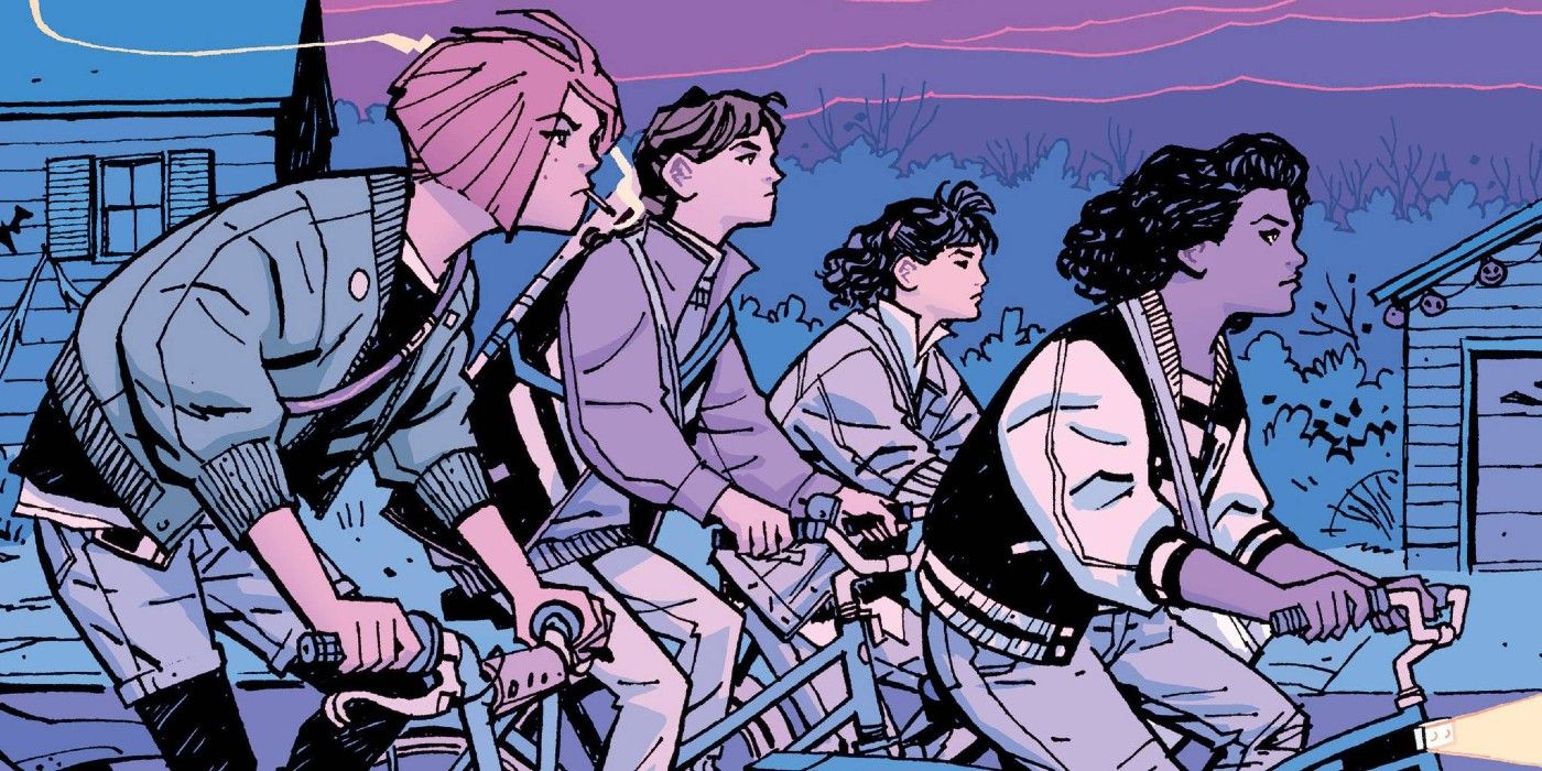Four teenage girls ride on their bicycles at night in Paper Girls.