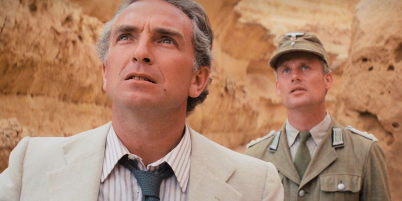 Paul Freeman looks up at Indy before a fly flies into his mout in Raiders of the Lost Ark