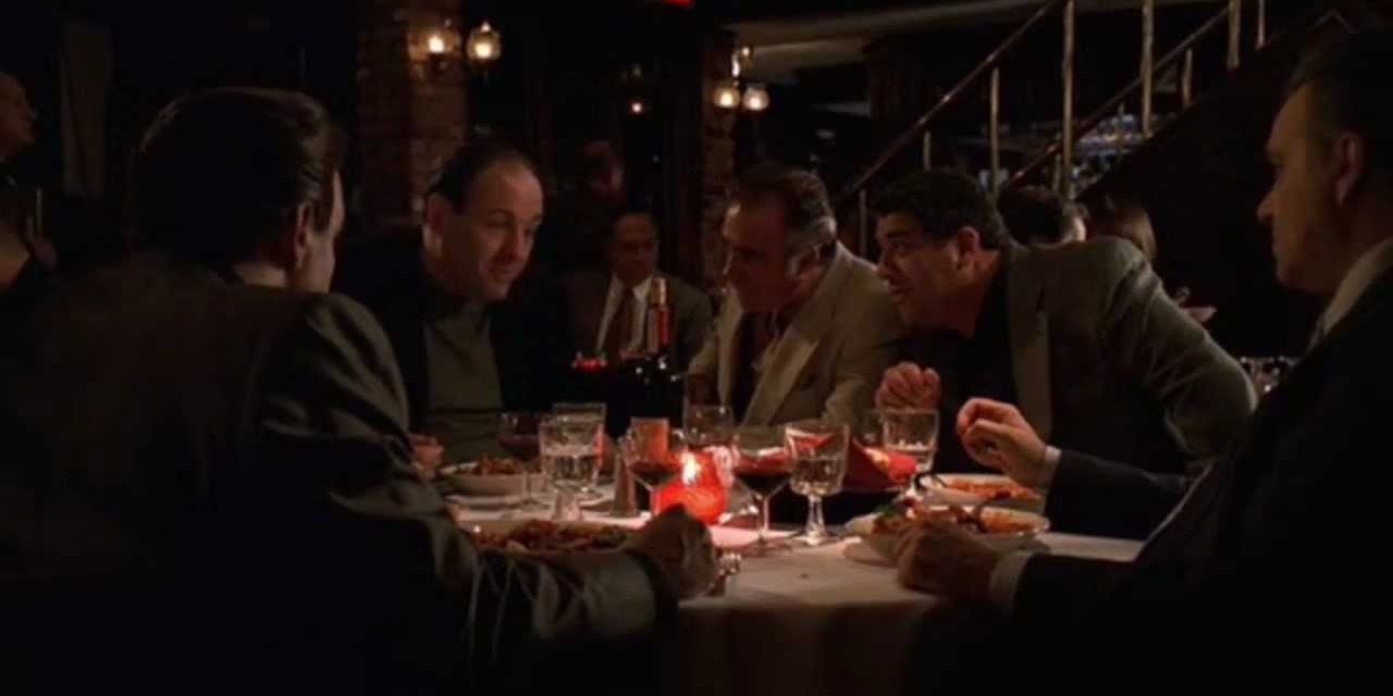 Paulie Walnuts tells a joke at dinner in The Sopranos