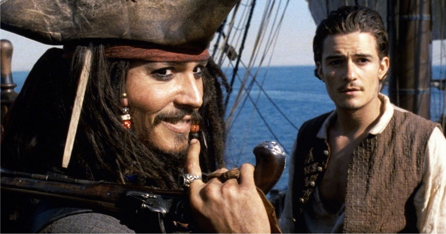 Pirates Of The Caribbean Jack Sparrow holding a gun with Will Turner