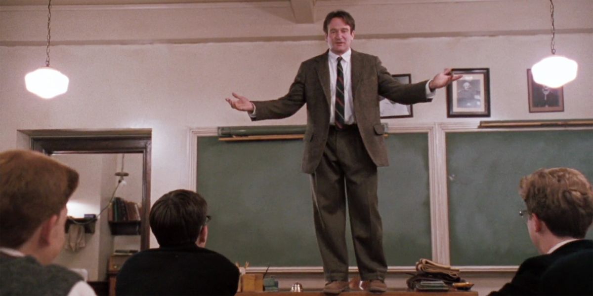 John Keating on a desk talking to his class in Dead Poets Society