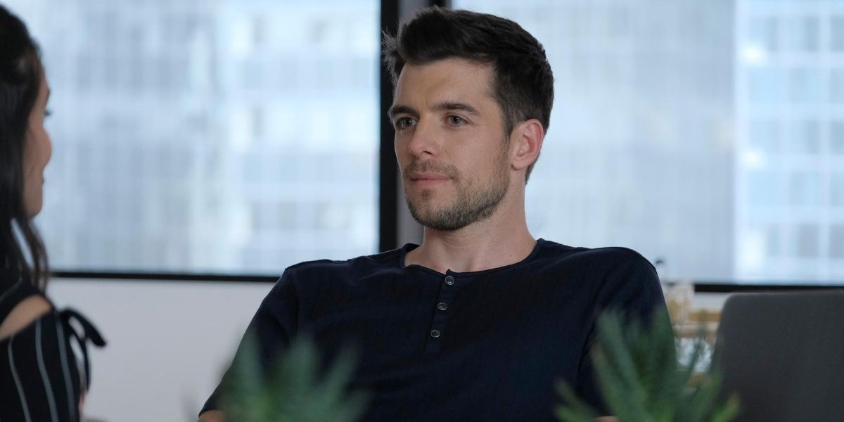 Ryan Decker sits in an office with Jane Sloan in The Bold Type