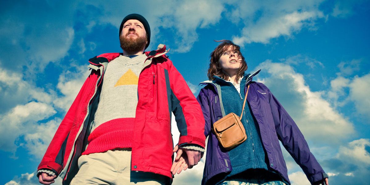 Two characters holding hands in Sightseers.