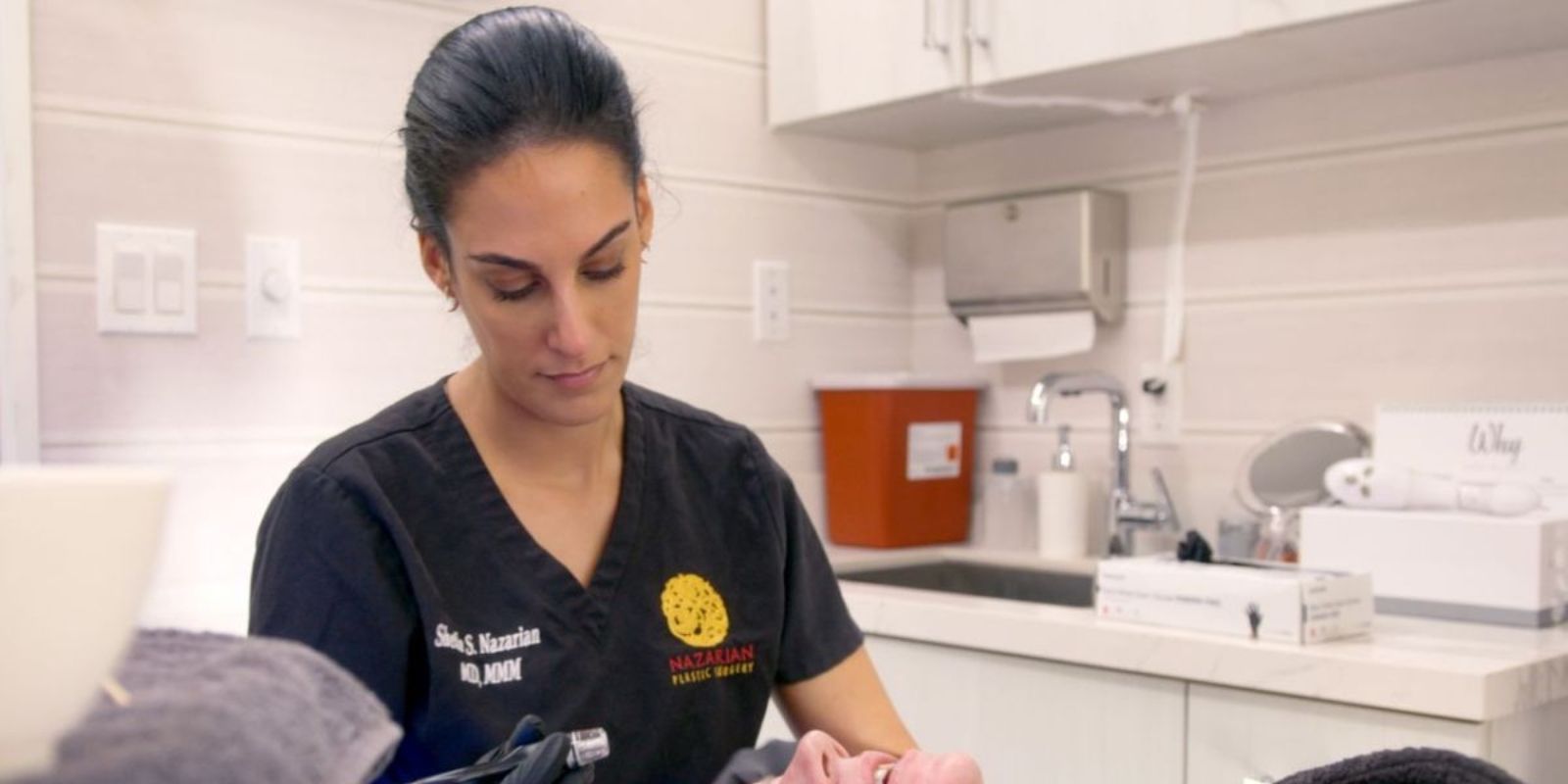 Dr. Shelia preparing for a patient.