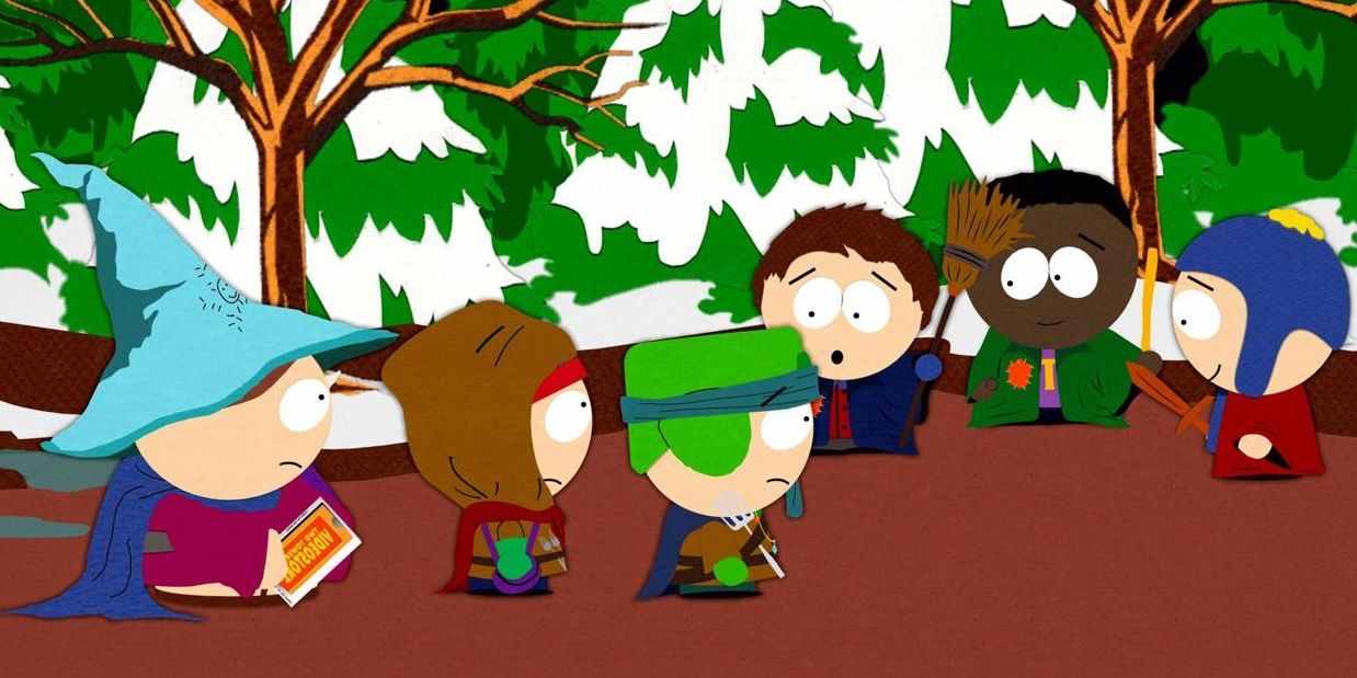 The kids standing in front of each other wearing costumes in the forest in South Park.