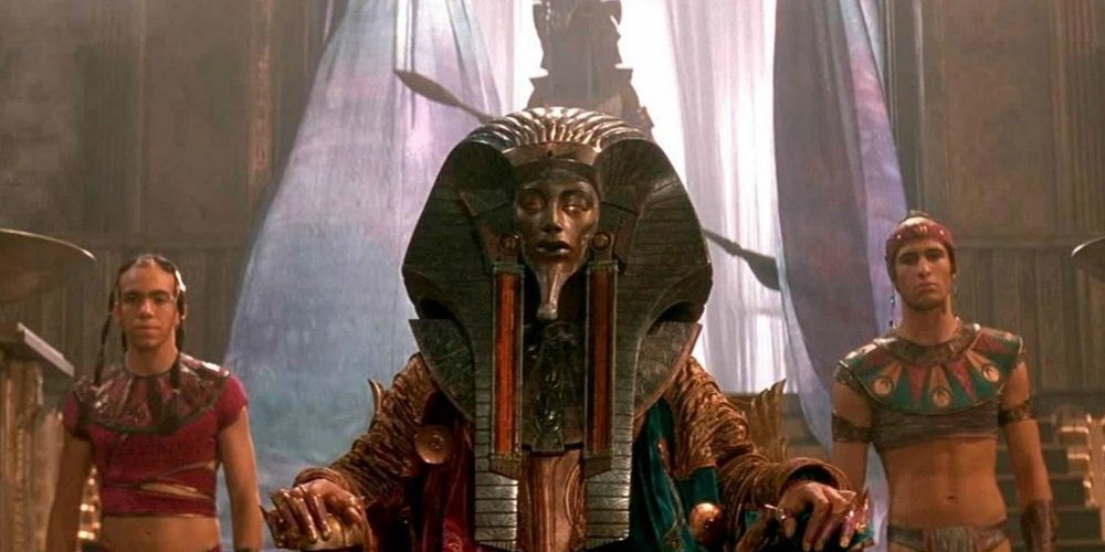 Ra sits on his throne with 2 guards beside him in Stargate.