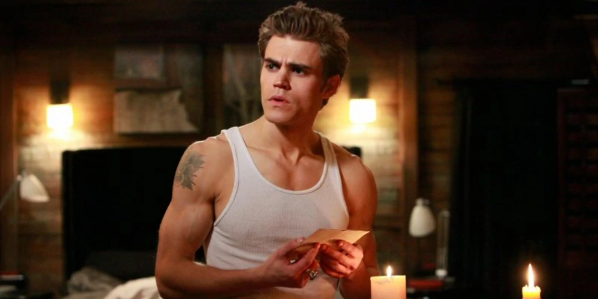Stefan standing in his room and looking confused in The Vampire Diaries.