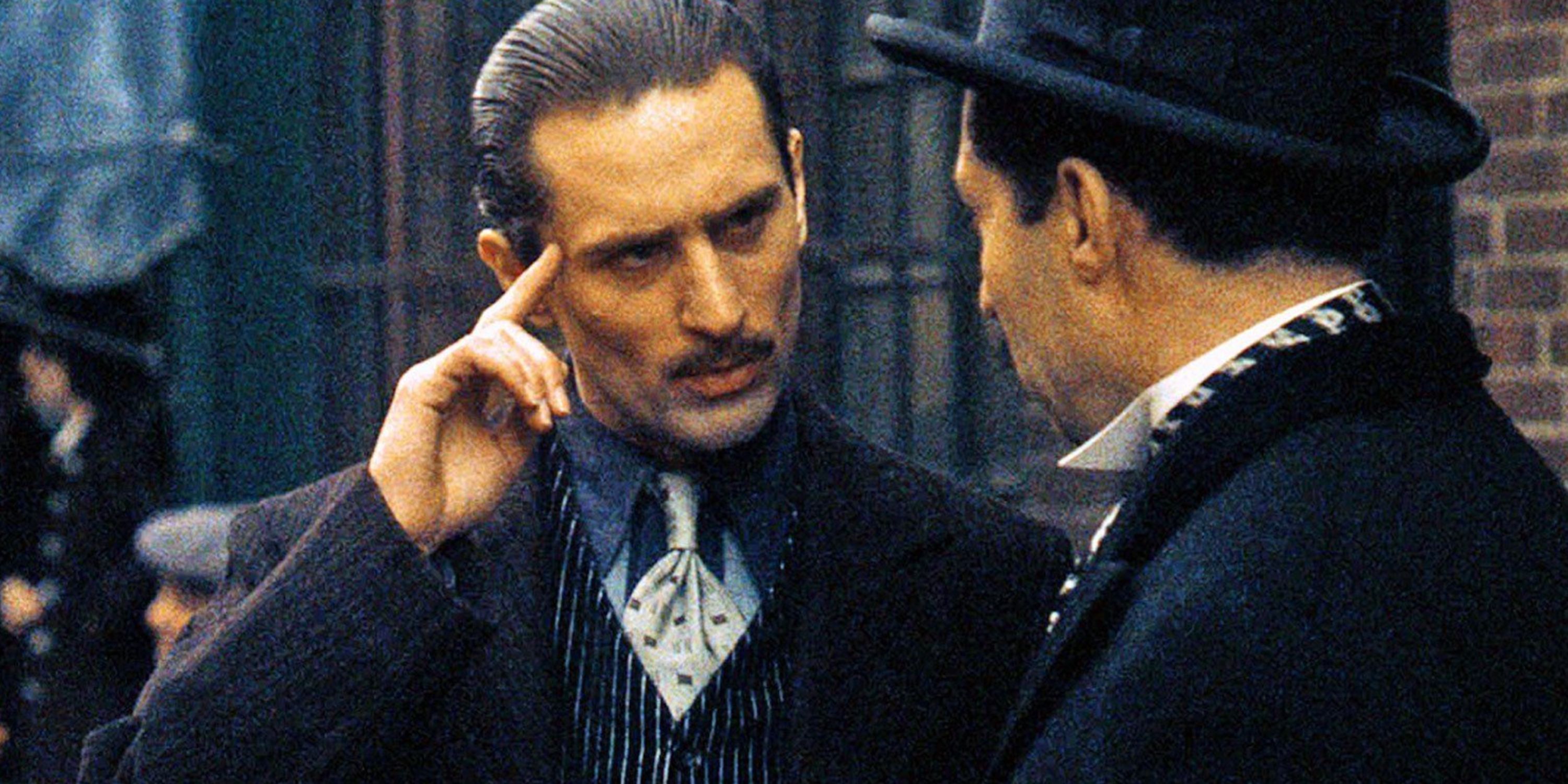 Robert De Niro as Vito Corleone in The Godfather Part talking to a friend on the street