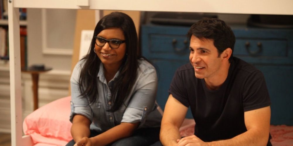 Mindy and Danny sitting on a couch together on The Mindy Project