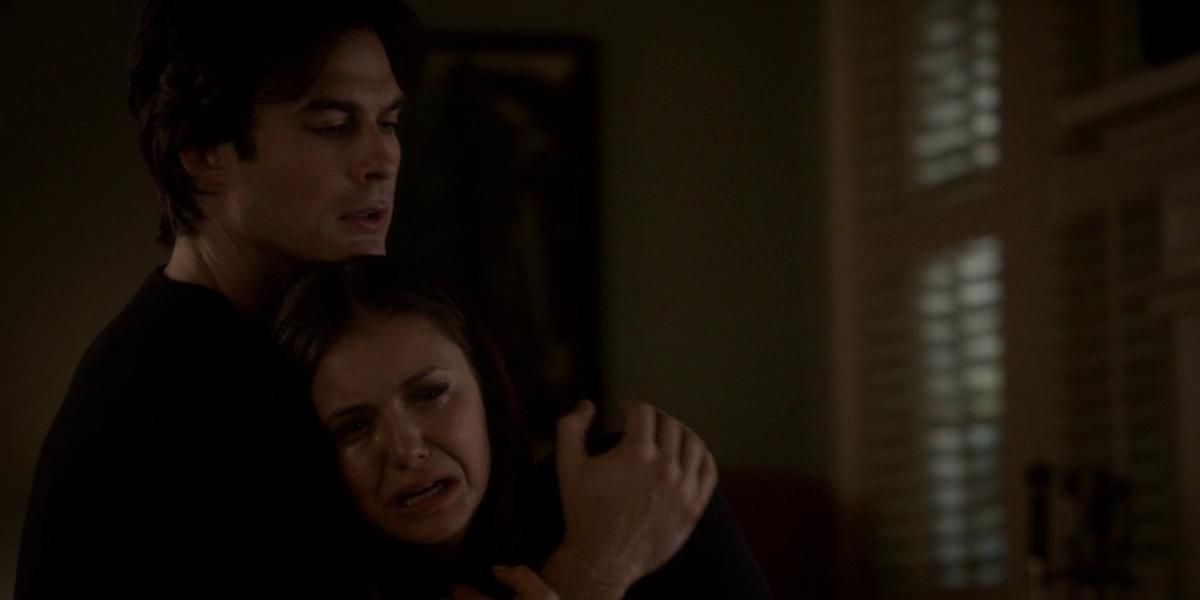 Damon holding Elena in The Vampire Diaries.