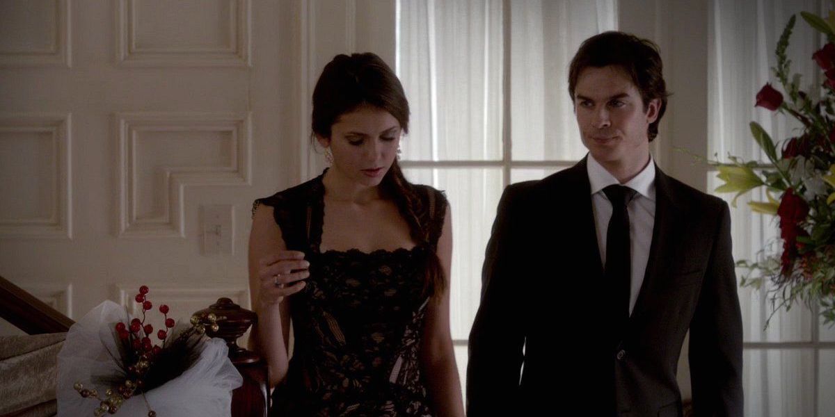  Elena and Damon walking together in The Vampire Diaries