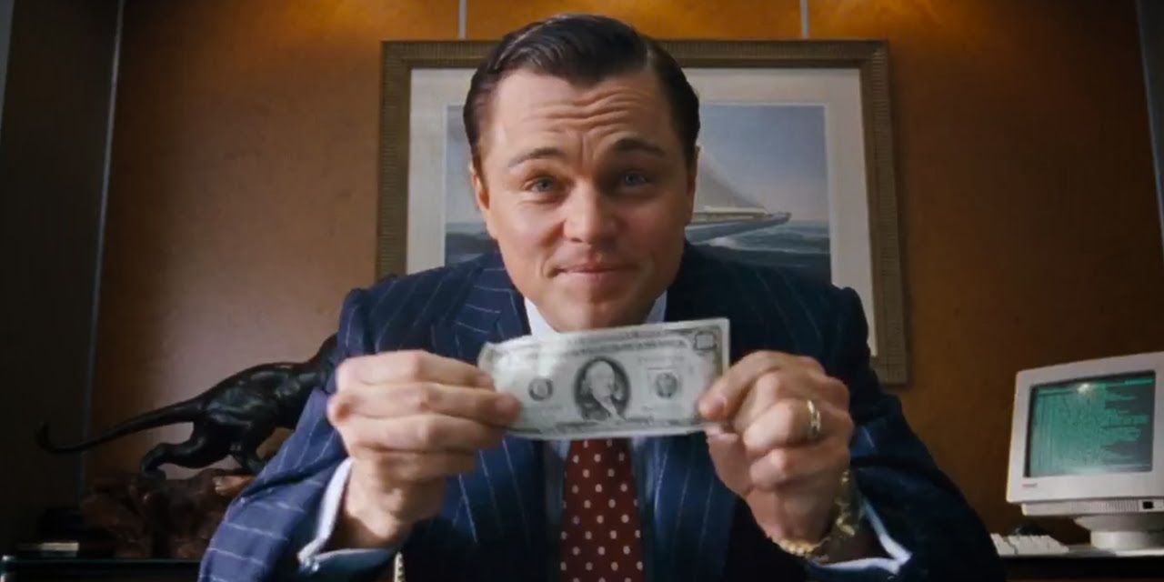 Jordan Belfort with money in The Wolf of Wall Street