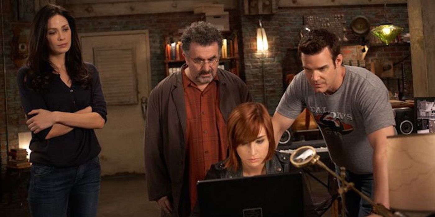 The heroes of Warehouse 13 looking at a computer.