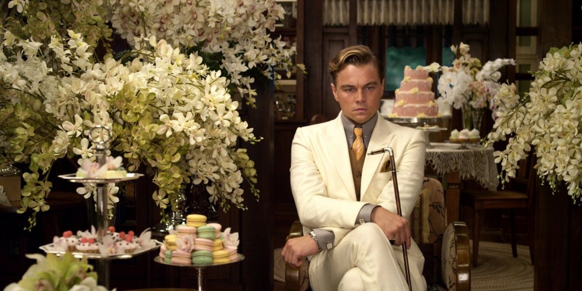Gatsby in a room full of flowers in The Great Gatsby