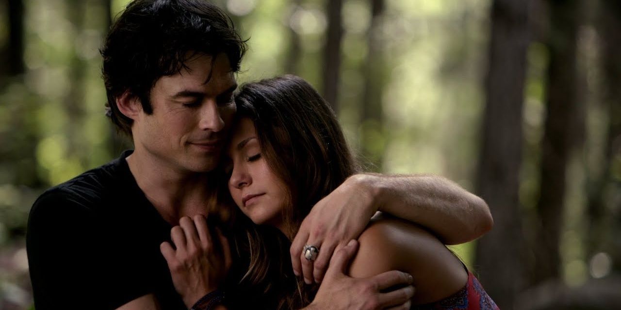 Elena and Damon hug in The Vampire Diaries.