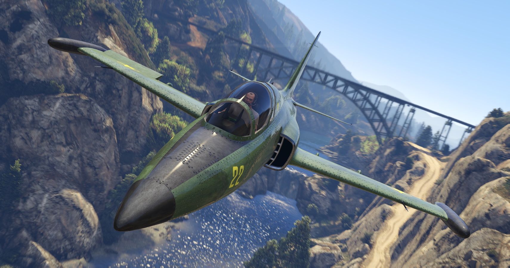 An image of Trevor flying a plane in GTA V, flying through a valley