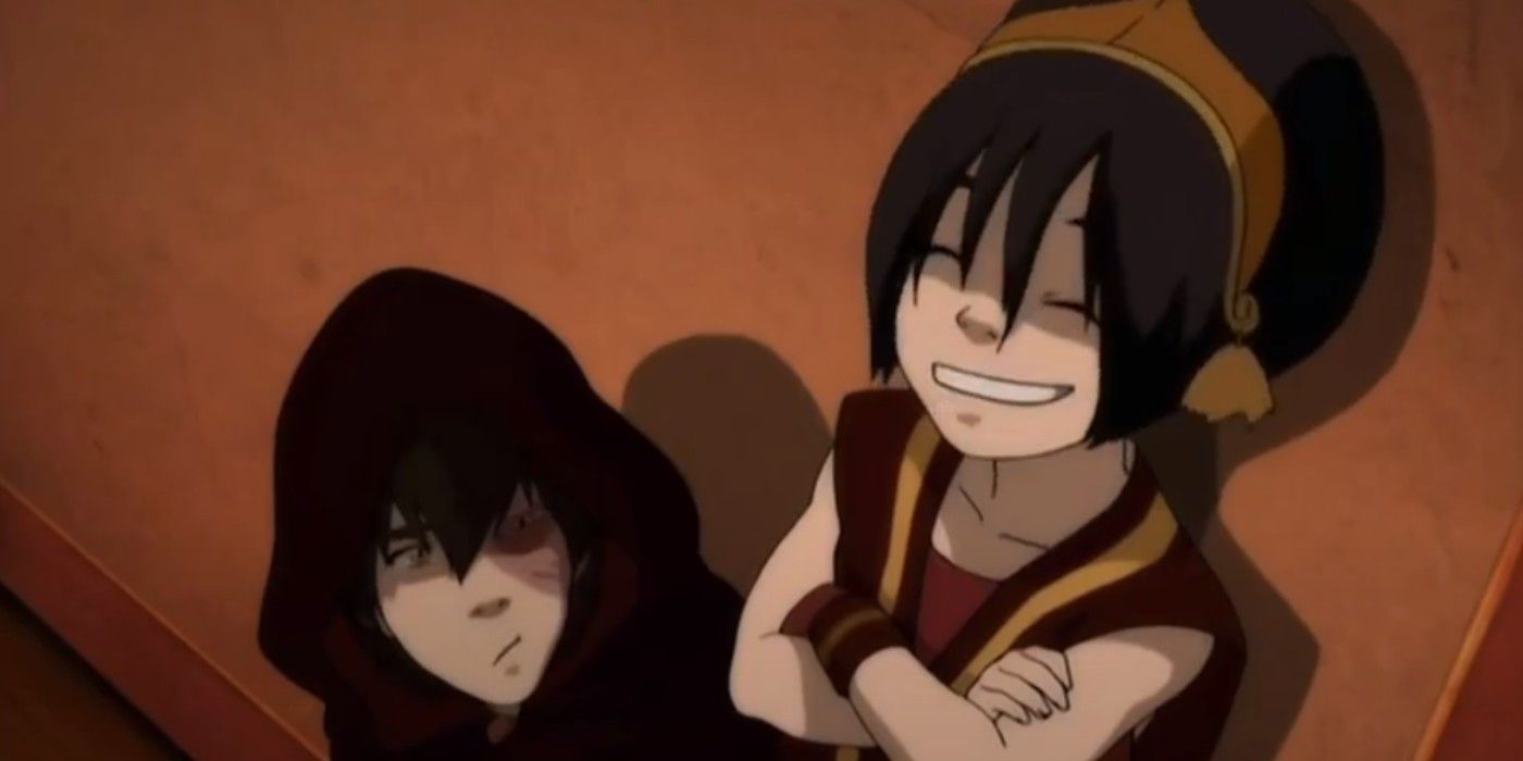 Zuko looks at a laughing Toph in Avatar: The Last Airbender.