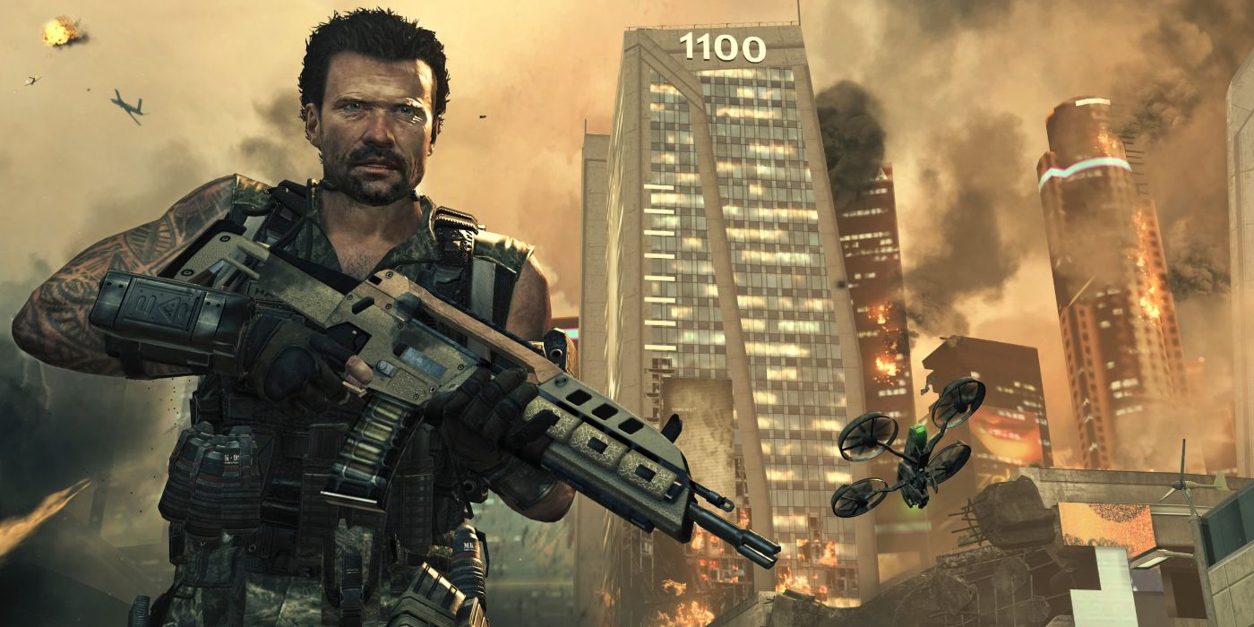 An image of the Call of Duty Black Ops II and Michael Rooker. He is seen holding a gun and standing in front of a building