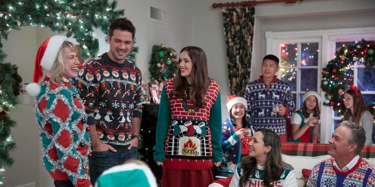 A family dressed in Christmas sweaters for Hallmark 