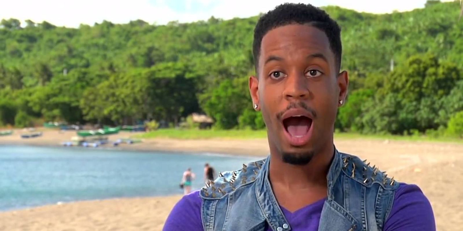 Brice stands on the beach with his mouth open in surprise on Survivor: Cagayan