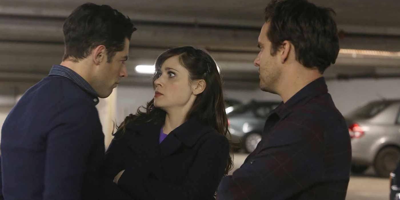 Schmidt tries to intimidate Jess while Nick watches in the New Girl episode Parking Spot