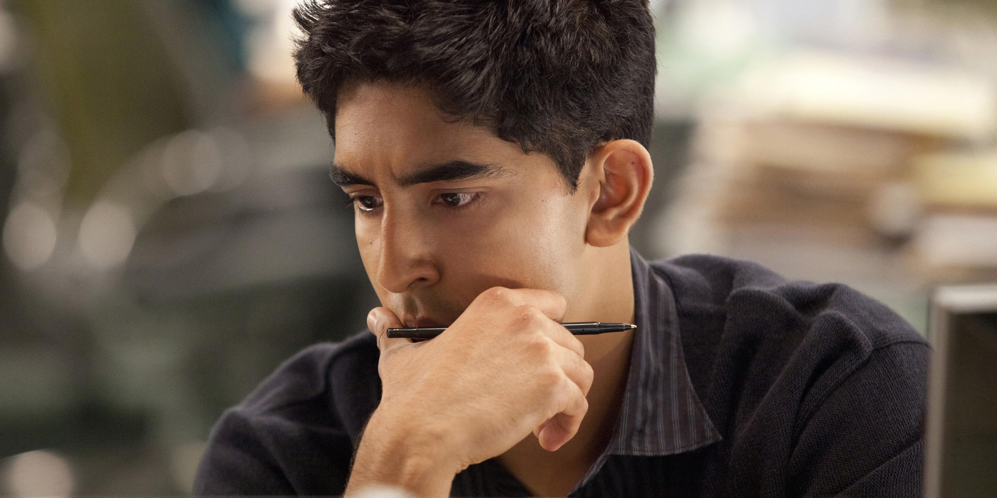 Dev Patel as Neal at his desk in The Newsroom